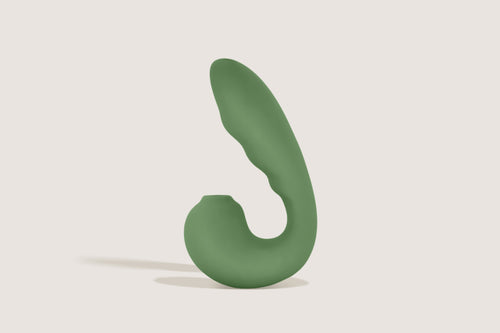 Labas Auréa dual-stimulation massager in sage green, featuring a flexible C-shaped design for simultaneous clitoral air-pulse and internal vibration.