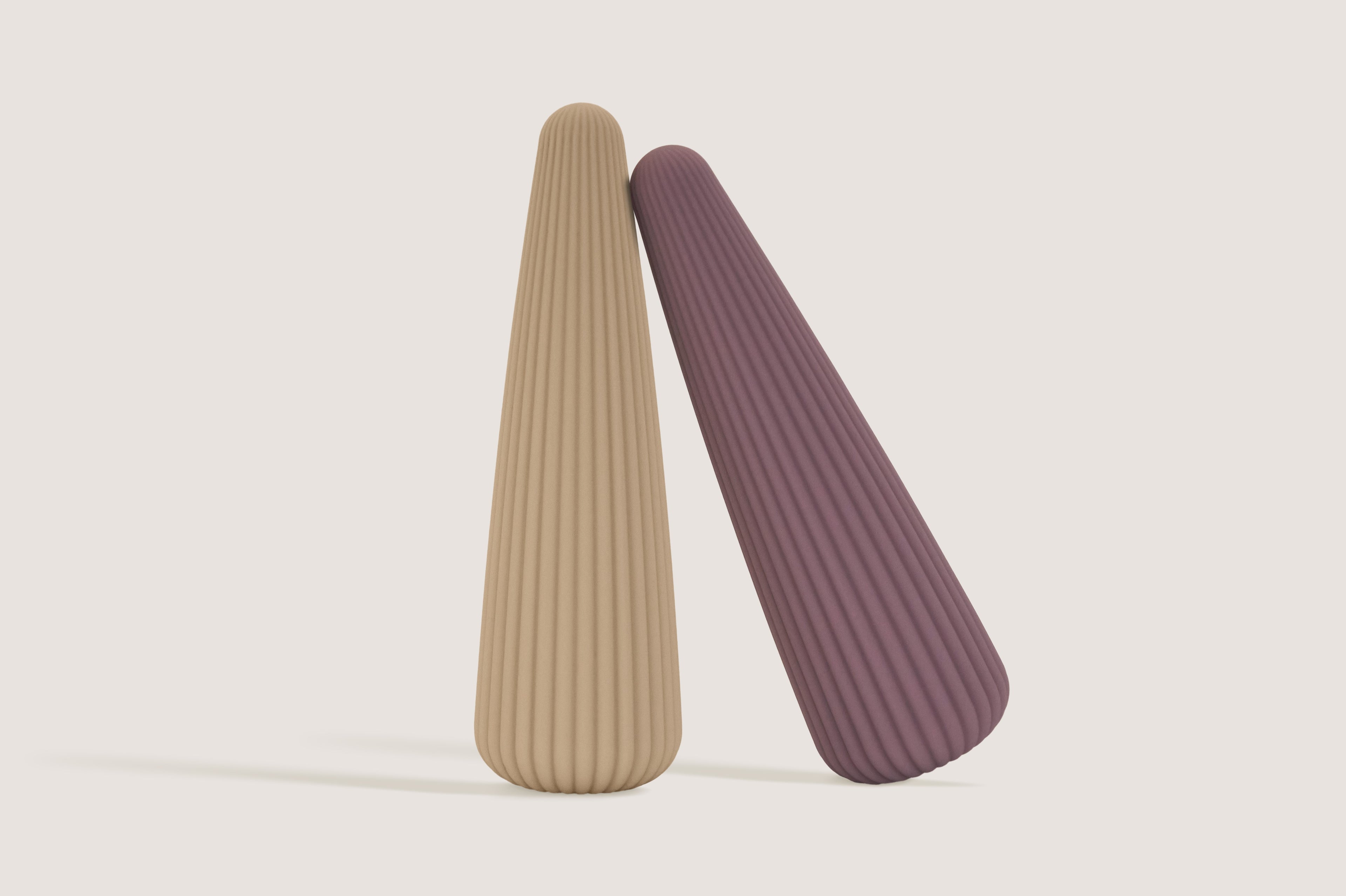 La-bas Cyra collection in rose gold and sand beige, showcasing the elegant pleated texture and sleek silicone design.