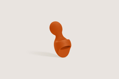 Labas Loopé orange finger vibrator designed as a compact extension of your senses for versatile external stimulation.