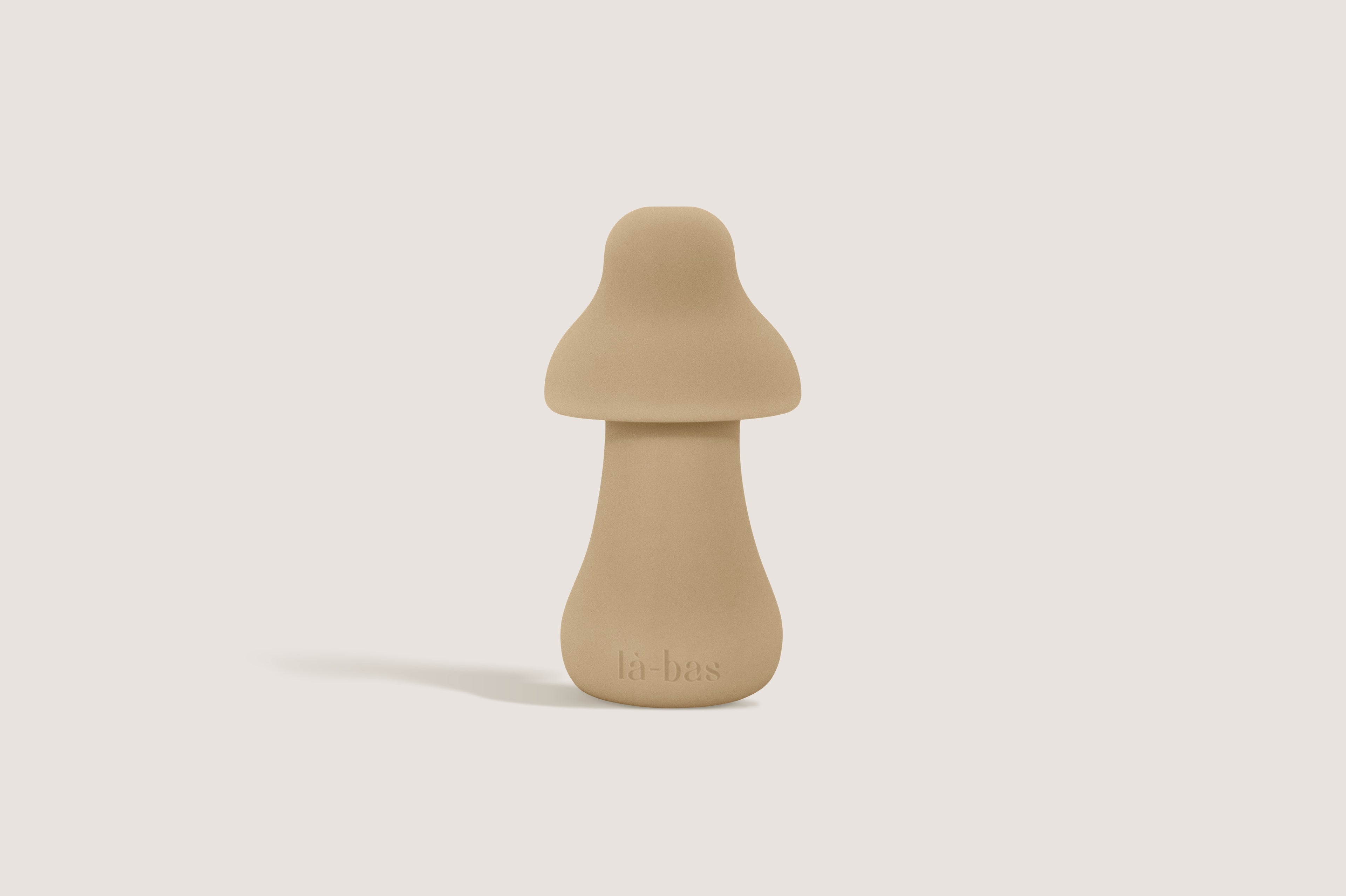 Labas Mushy compact silicone pleasure massager in beige, featuring a soft-touch shell and mushroom-inspired design for external stimulation.