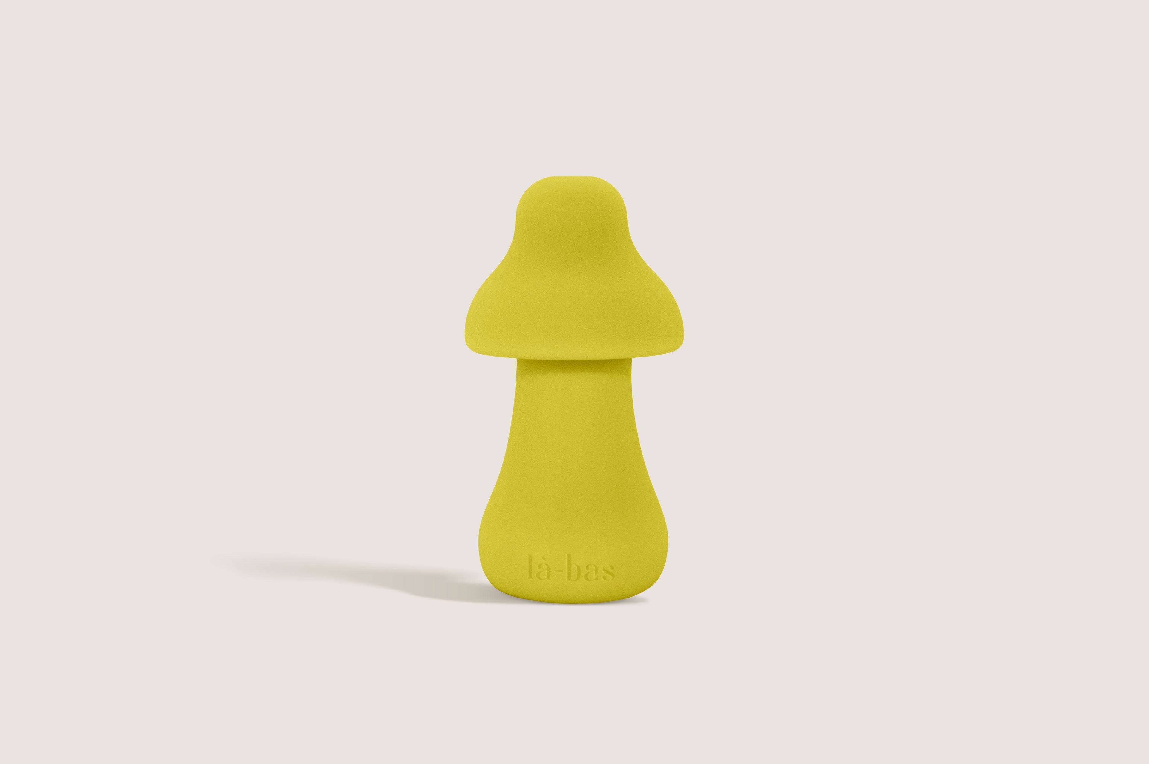 Labas Mushy portable pleasure massager in vibrant yellow, showing its ergonomic mushroom shape for targeted clitoral stimulation.