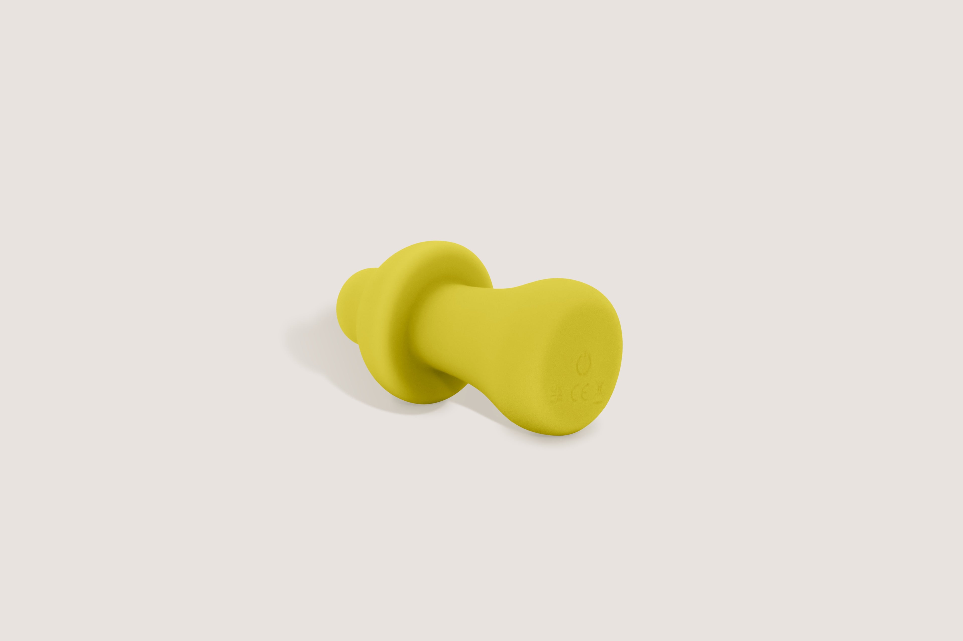 Labas Mushy silicone massager detail view, showcasing the seamless base and power interface of the yellow-colored pocket massager.