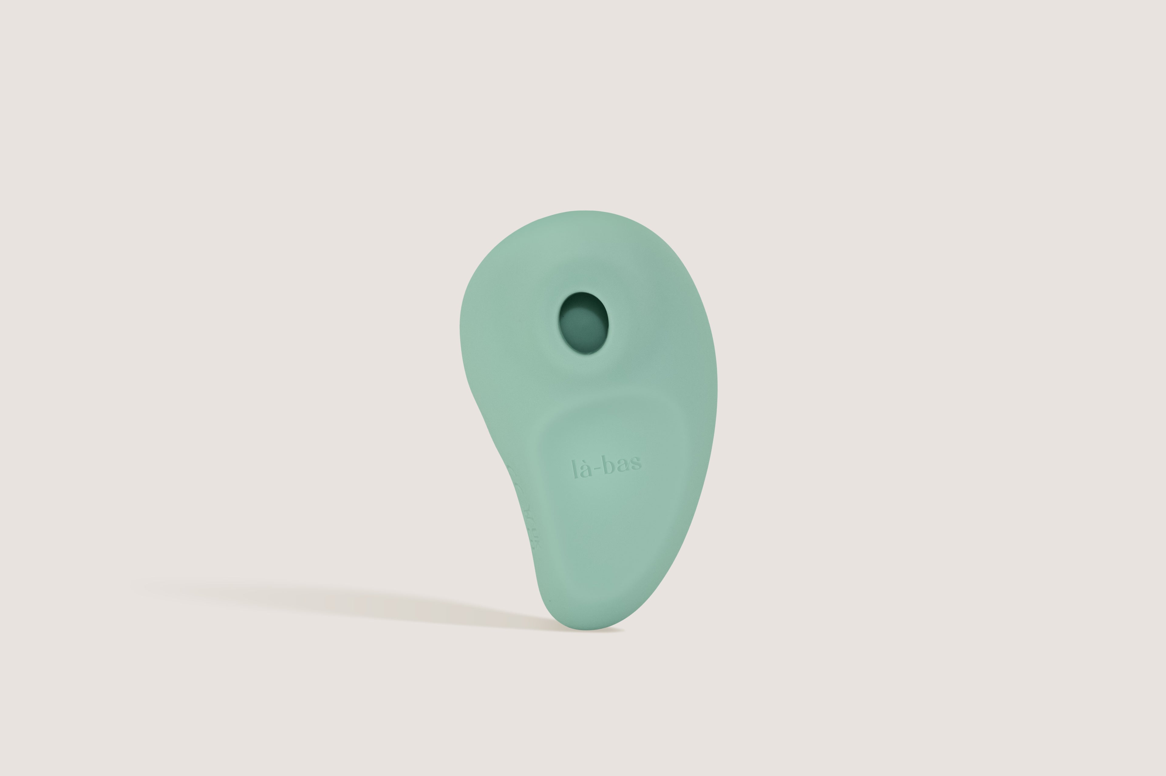 La-bas Orae suction vibrator in mint green, featuring mango-inspired soft curves for tropical bliss.