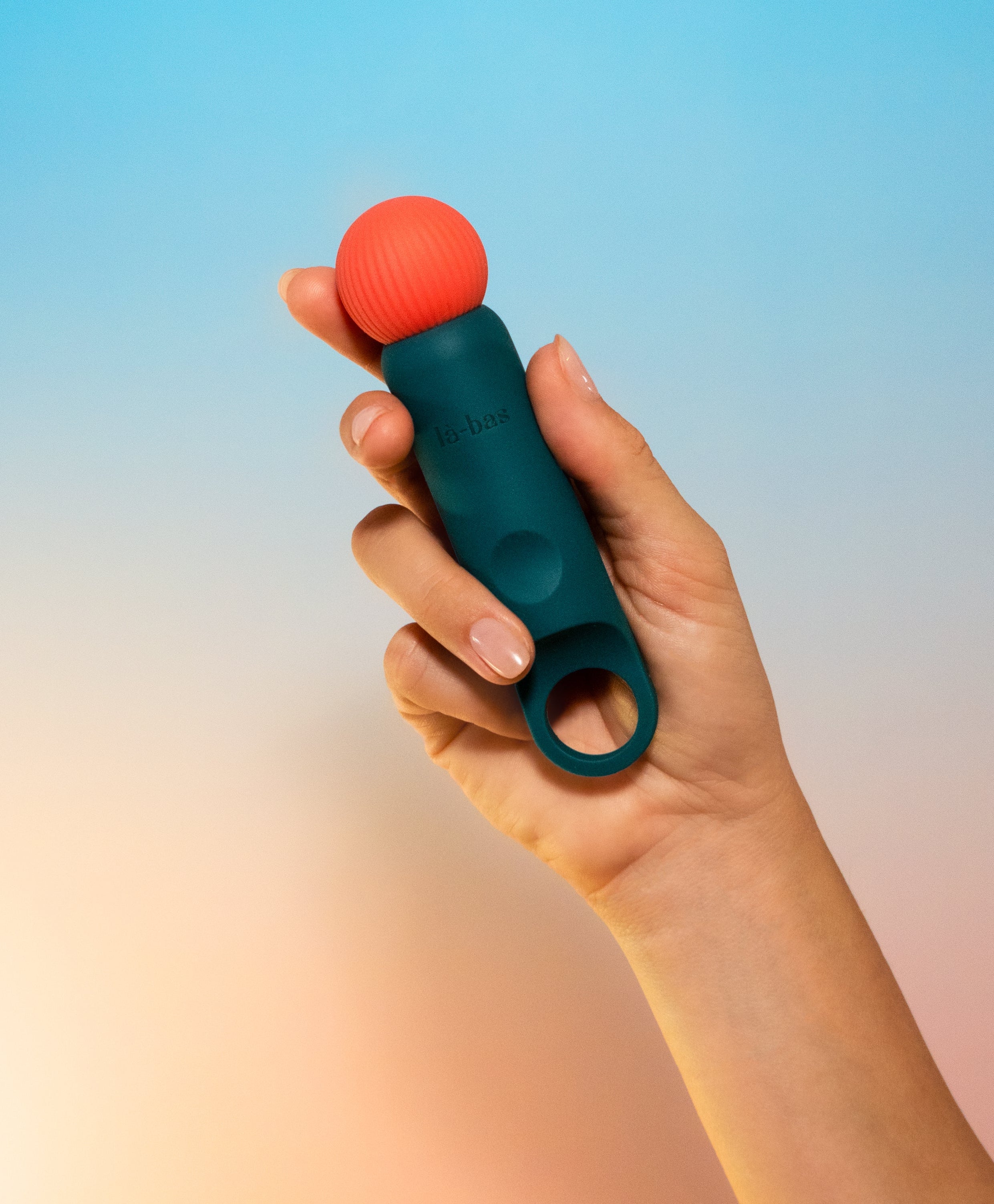 Labas Veya mini vibrator held in hand to show its compact size, smooth and elastic body-safe silicone texture, designed for external stimulation and comfortable solo or shared pleasure.
