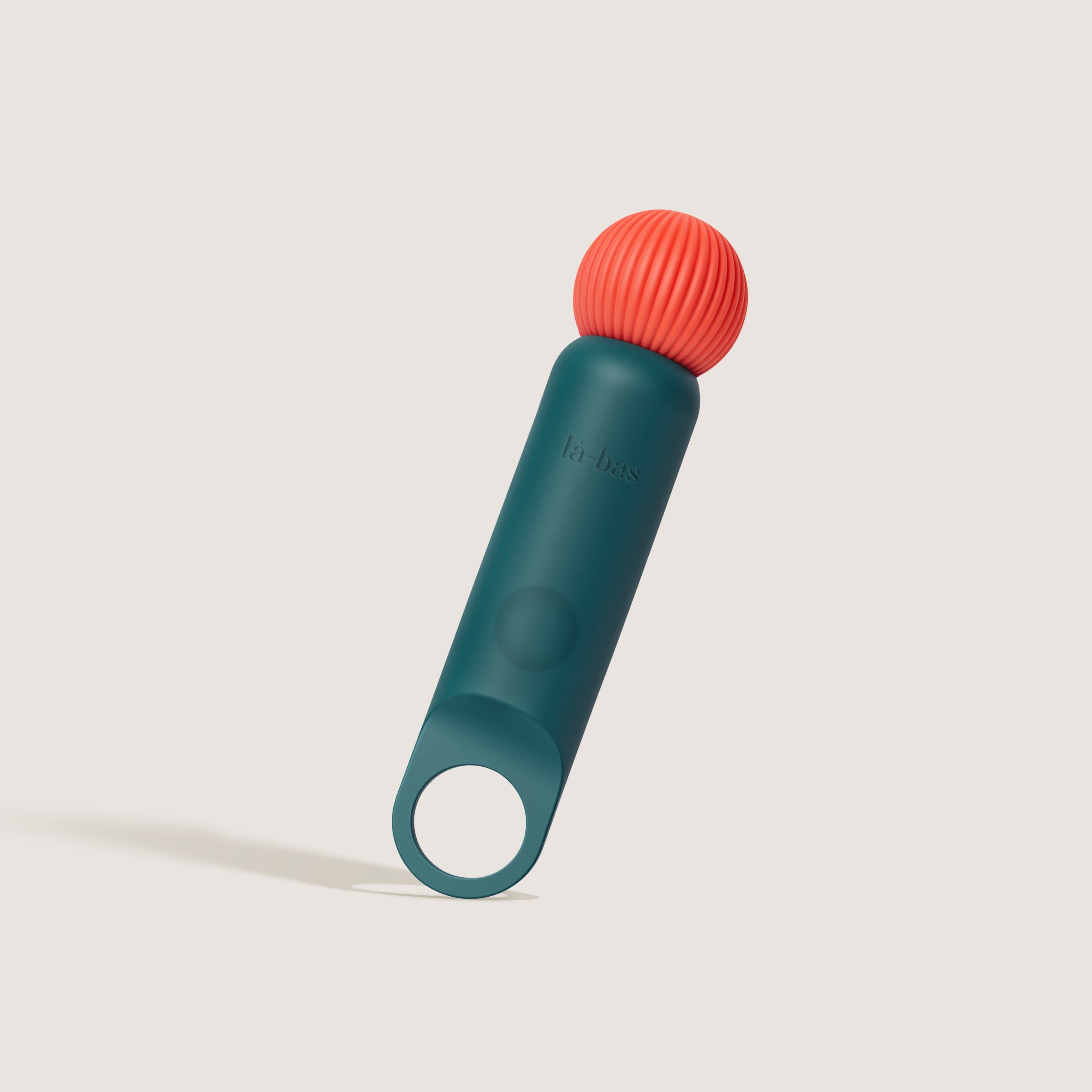 La-bas angled shot of the Veya green vibrator featuring a ring-shaped base and ribbed massage head.