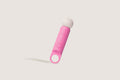 La-bas angled shot of the Veya pink vibrator featuring a ring-shaped base and ribbed massage head.